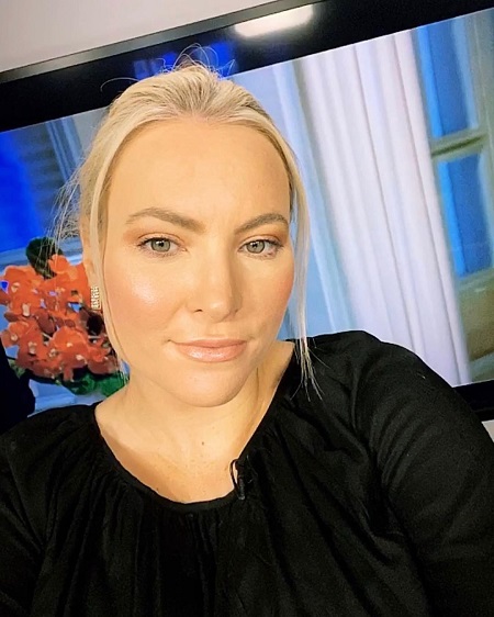 Meghan McCain taking a selfie in her home during a show.